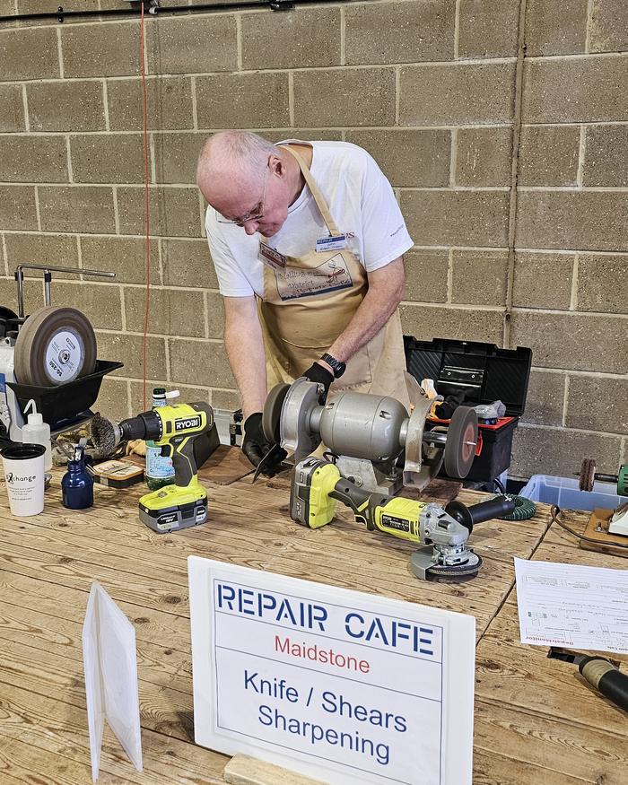 Volunteer sharpening knives and shears