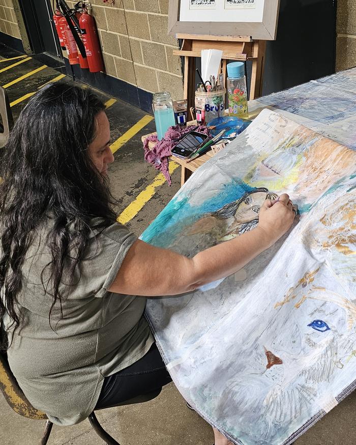 Artist painting live at the Art Zone