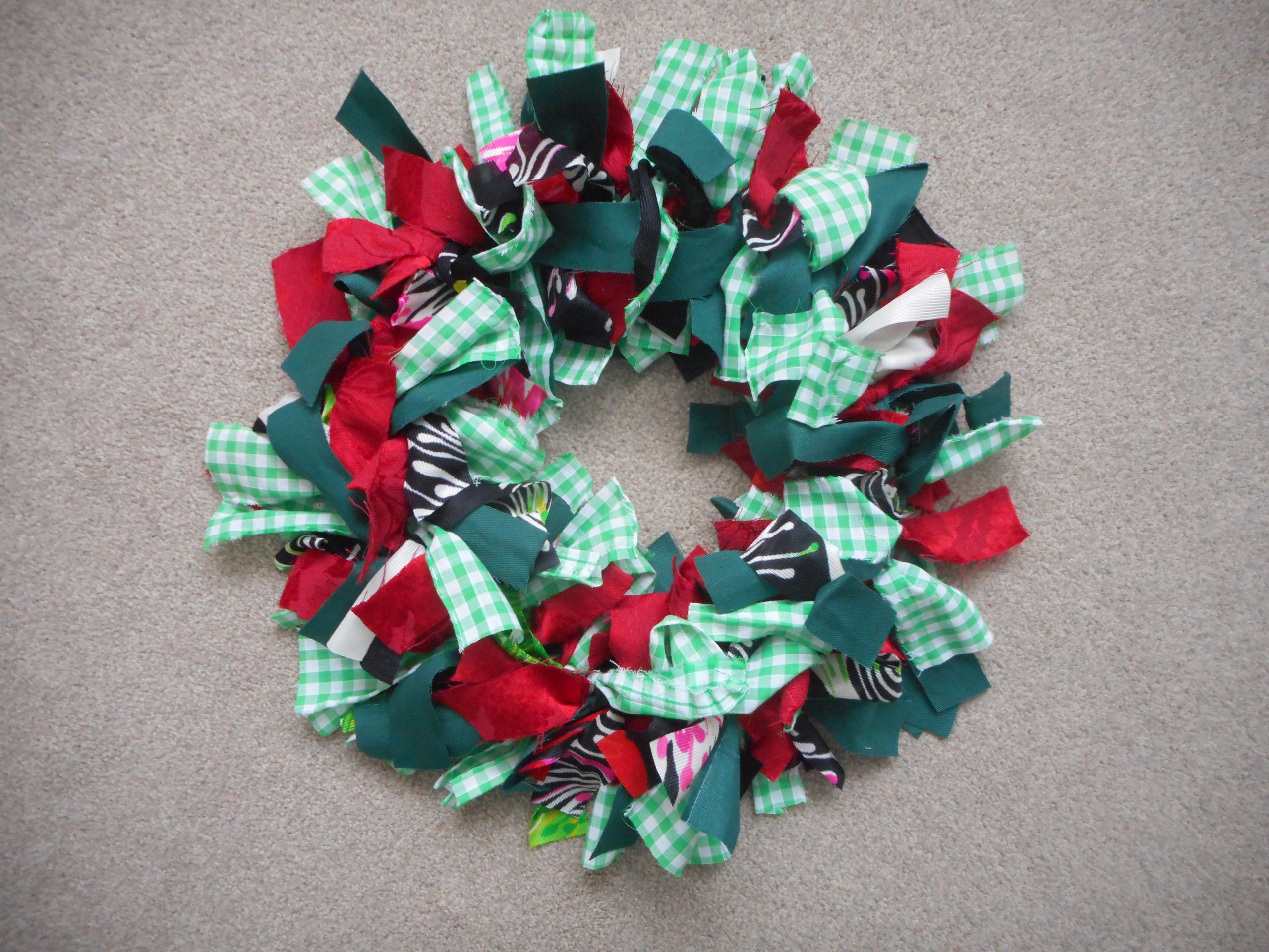 Christmas wreath made from scrap textiles by Sue Pritchard